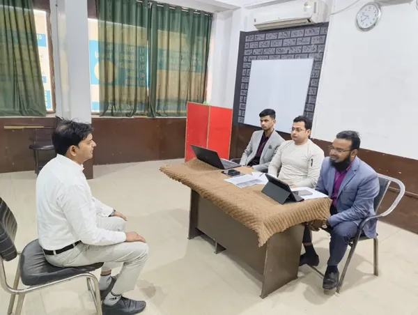 Interview panel assessing a candidate