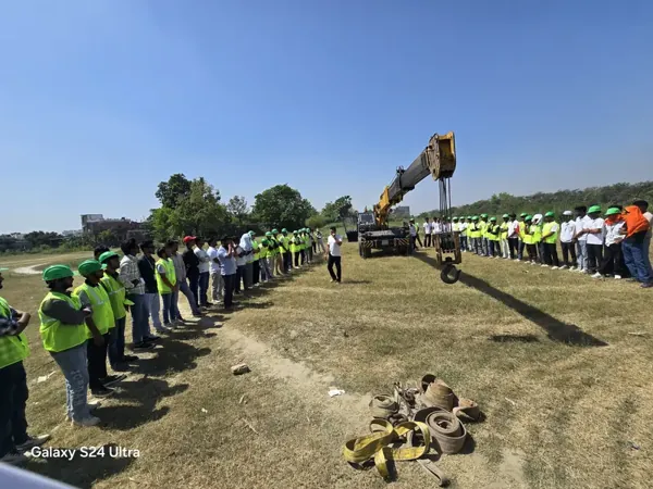 Students observing a mobile crane